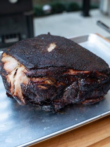 A smoked pork butt fresh off of the smokeand taken out of the wrap