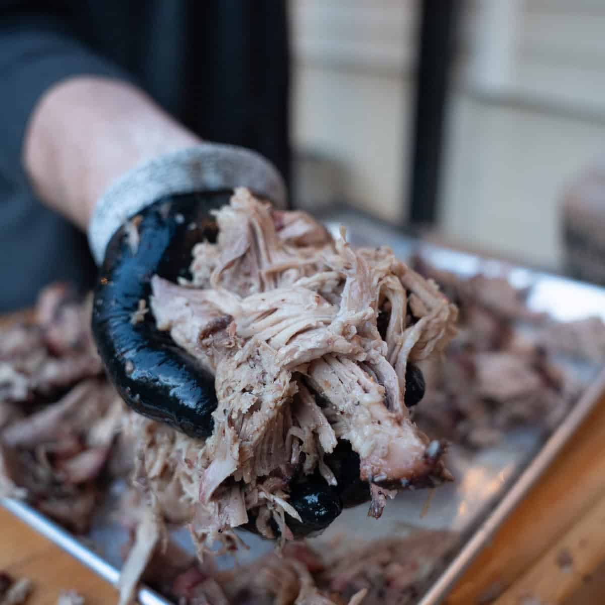 A handful of pulled pork that has recently been shredded